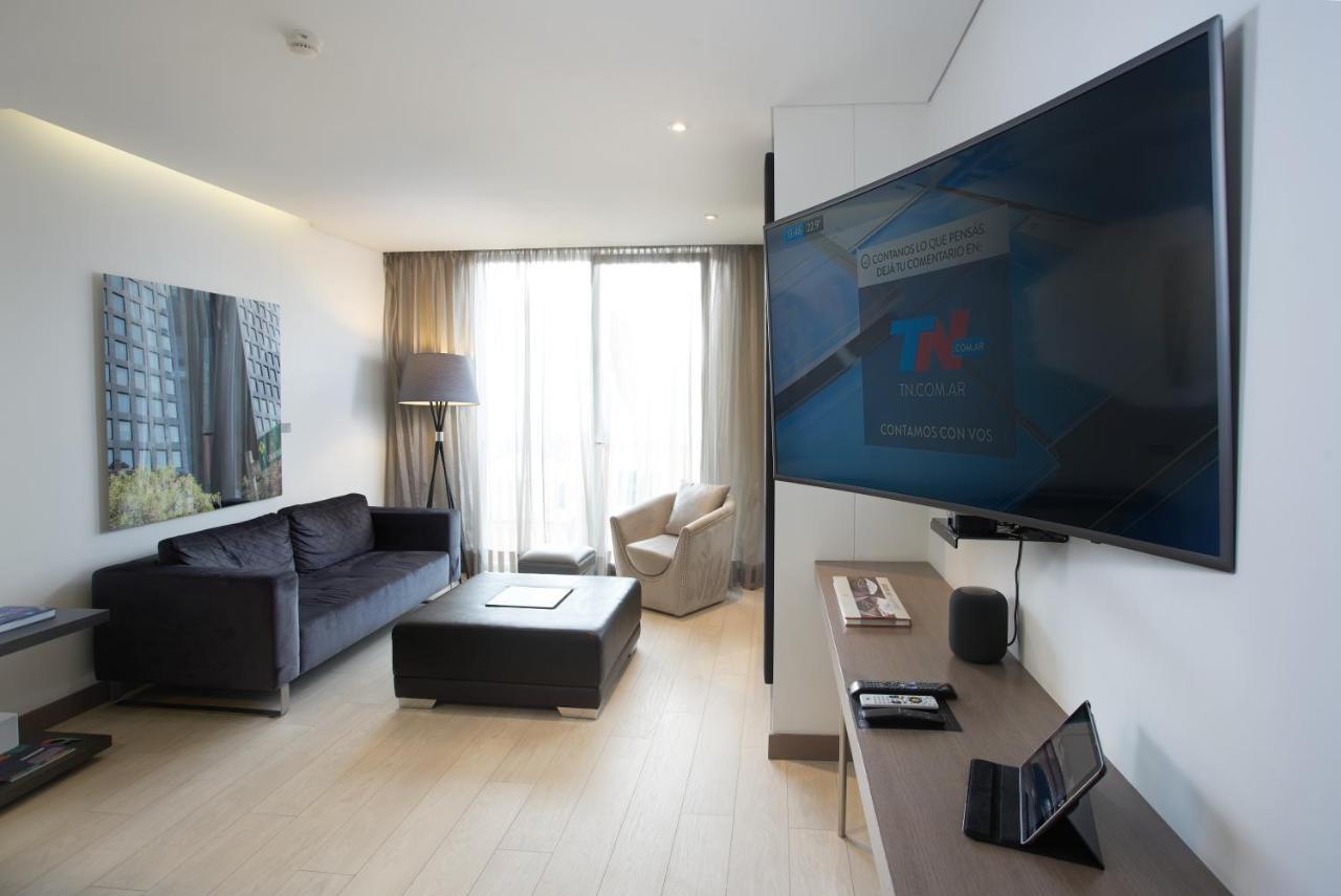 Hotel 100 Luxury Suites By Preferred Богота Екстериор снимка A television set in a hotel room